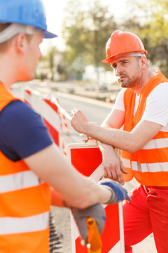 Construction workers smoking cigarette