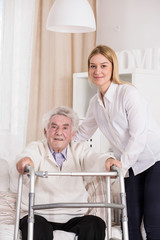 Obraz premium Disabled man using walking frame