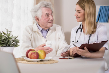 Doctor visiting patient at home