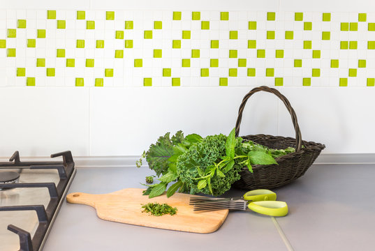 Basket with herbs on a kitchen top