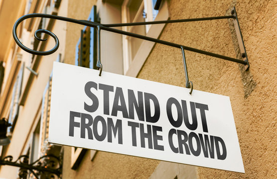 Stand Out From the Crowd sign in a conceptual image
