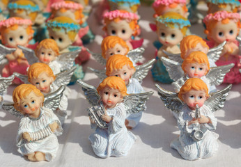 Figurines of angels on a market in Poland