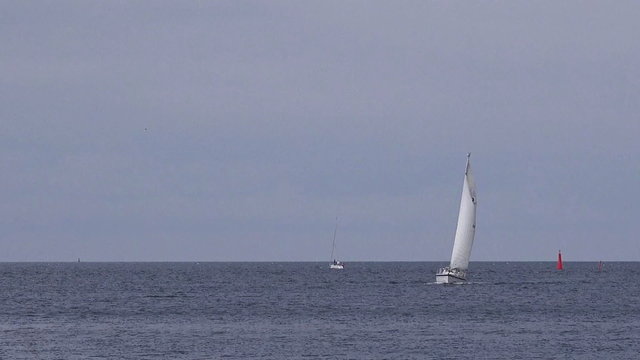 Small Sailing Yacht Boat at Sea, Sailboat Cruising Offshore, Bright Summer Day