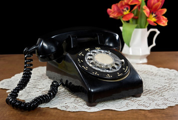 retro rotary dial telephone with tulips