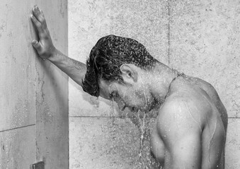 Attractive Young Muscular Man Taking Shower