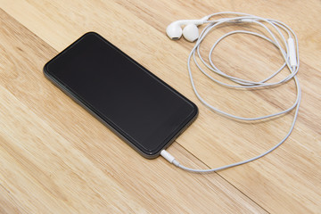 smart phone and note on wooden background
