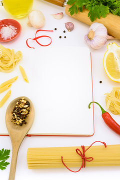 Italian pasta with vegetables and mushrooms on blank notebook