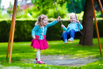 Kids on playground swing