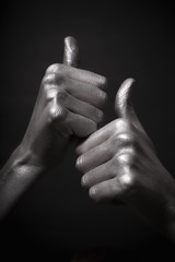 human silver hand with a thumb up