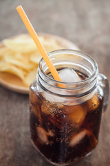 Iced cola with potato chips