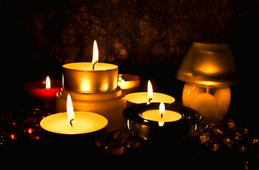 Group of candles against a dark background