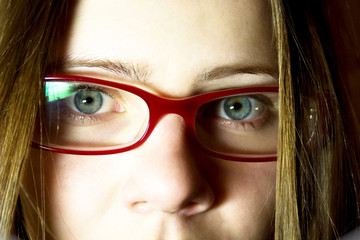 Portrait of the young woman in glasses