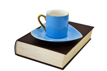  book, cup and saucer