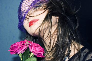 young woman in the veil with roses