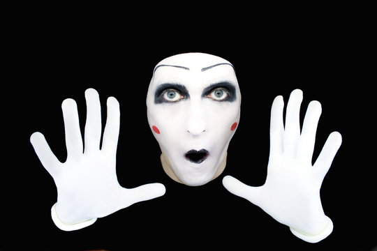 Portrait of the mime in white gloves