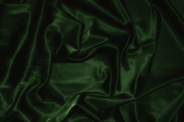 texture of a dark green silk