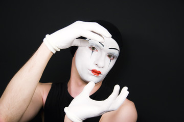 mime in white gloves