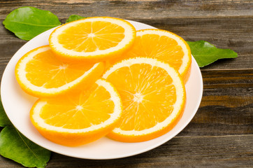 Slice of Navel orange fruit on the white plate