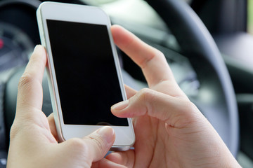 Woman Sitting in the Car and Using Smart Phone