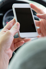 Woman Sitting in the Car and Using Smart Phone