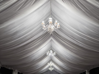 classic chandeliers on event party tent