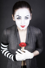 woman  mime with  red flower