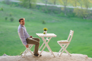 Smiling Man at Table