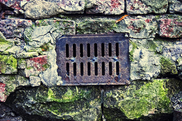 water drain lattice on brick surface