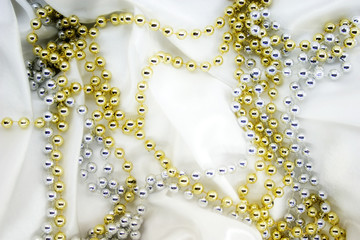 beads on white silk