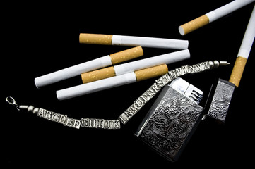 Cigarettes, a lighter and a bracelet