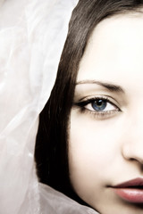 beautifful woman with dark blue eyes in a silk scarf