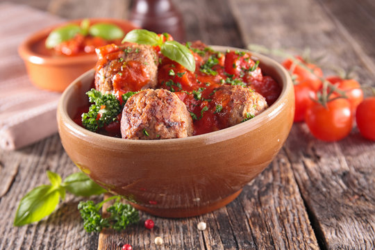 fried meatballs with tomato sauce and herbs