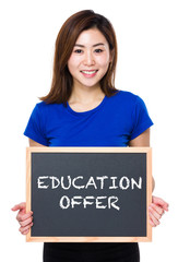 Asian woman hold with chalkboard and showing education offer