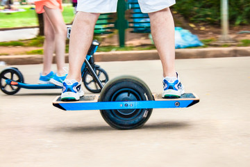Skateboarder riding onewheel electric skateboard