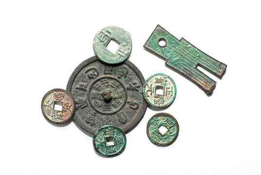 Ancient Chinese bronze coins on a white background