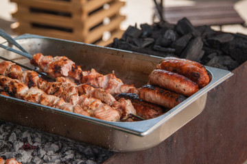 Prepared shashlik and sausages