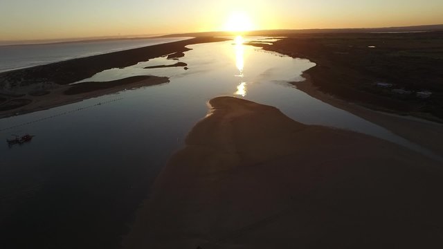 Sunset Aerial footage images and elevated view of river murray mouth in coorong and lower lakes. Famous place for coorong sandhills, sand dunes, wetlands, fishing and and boating in South Australia