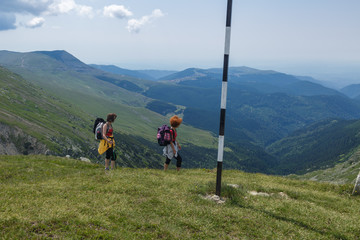 Fototapeta premium Two sister hiking into the mountains