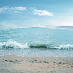 Wave of the sea on the sand beach
