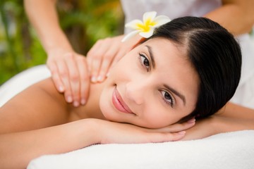 Obraz na płótnie Canvas Attractive woman receiving back massage