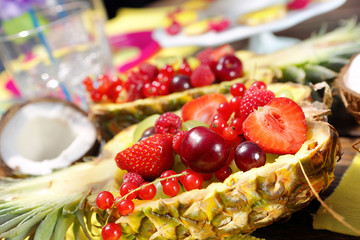 Fruit salad in pineapple on a Hawaiian party