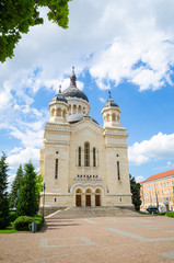 Fototapeta na wymiar Cluj Napoca Orthodox Cathedral in portrait view on a sunny summer day with a blue sky and a beautiful look in Transylvania Romania