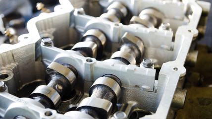 Open engine block exposing the pistons and crankshaft in a service