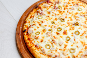 pizza on wooden plate