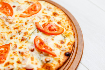 pizza on wooden plate