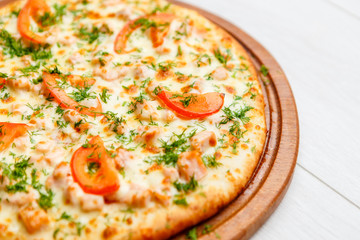 pizza on wooden plate