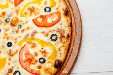 pizza on wooden plate