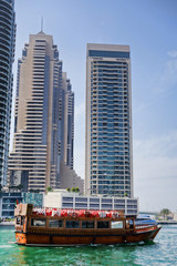 Fototapeta premium Dubai Marina with skyscrapers and boats in Dubai, United Arab Emirates
