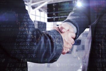 Fototapeta na wymiar Composite image of business people shaking hands close up