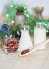 Almonds caramel with milk on table. Selective focus, shallow DOF